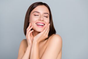 Woman smiling with youthful, tight skin from Ultherapy in East Greenwich, RI